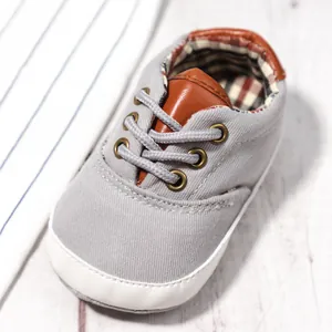 Grey canvas baby walking shoes for 0-12 months with soft soles and plaid lining