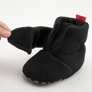 Detail of baby winter boots showing the Velcro strap closure and plush fleece lining