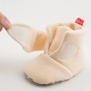 Detail of warm baby winter boots showing thick fleece lining and velcro closure