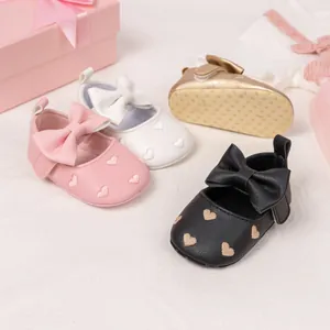 Detailed view of anti-slip soft soles and heart embroidery on baby princess shoes