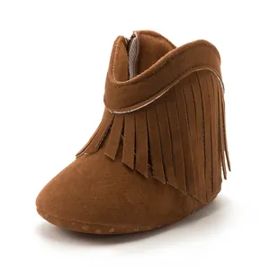 Detailed view of dark brown suede baby tassel boots with anti-slip soft soles