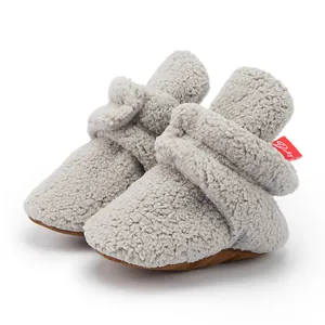 Detail of high-quality light grey sherpa baby boots with a soft non-slip sole for winter