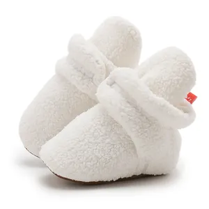 Soft white fleece baby walking shoes with hook-and-loop strap and warm plush lining