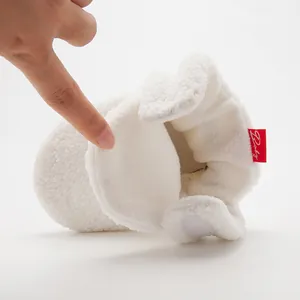 Detail of baby soft-sole fleece boot showing velcro closure and warm plush inner lining