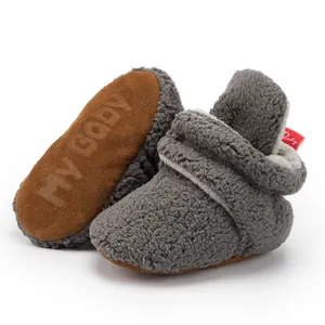 Gray plush baby walking shoes with soft non-slip soles and warm faux shearling lining