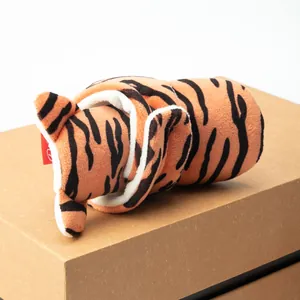 Detailed close-up of tiger pattern winter baby shoes with soft white plush lining