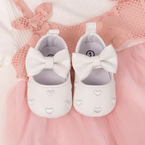 White baby girl princess shoes with large bow and heart embroidery on soft non-slip soles