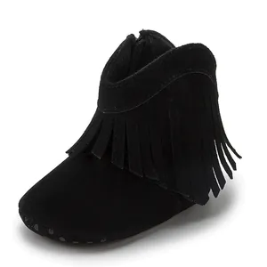 Detail of black suede baby boots featuring side zipper and non-slip dotted sole