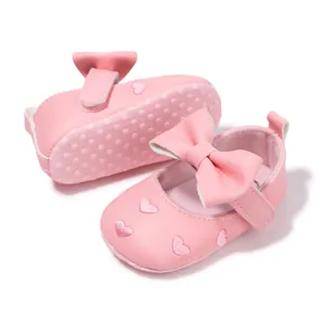 Pink infant Mary Jane shoes with heart embroidery and non-slip bow design