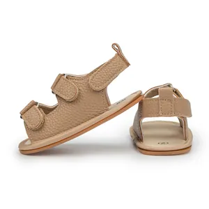 Detail view of khaki baby sandals featuring textured PU leather and double velcro straps