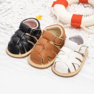 Toddler sandals in black, brown and white with woven straps and soft non-slip soles