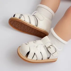 Close-up of baby walking sandals with non-slip rubber soles and breathable woven upper