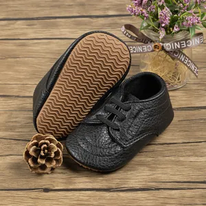 Close-up of litchi texture synthetic leather baby shoes with anti-slip wave soles