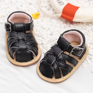 Summer baby sandals in black faux leather with soft soles and non-slip design