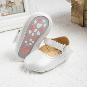 White Mary Jane baby shoes with scalloped edges and non-slip soles for infant girls