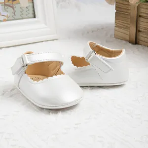 White baby Mary Jane shoes with pearl luster and scallop trim for 0-6 months infants