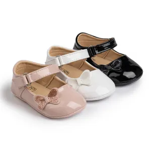 Toddler girl Mary Jane shoes in pink, white, and black faux leather with glitter bows