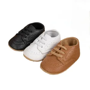 Baby walking shoes set in black white and brown faux leather with lace-up design