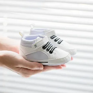 White soft sole baby walking shoes with velcro strap and striped elastic laces