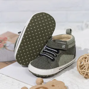 Detailed view of olive green baby walking shoes with anti-slip soft soles and velcro straps
