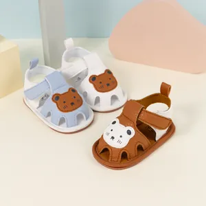 Detail view of baby sandals with bear patch and breathable perforated toe design