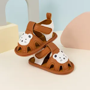 Brown and beige baby walking sandals with cute bear patches and soft soles