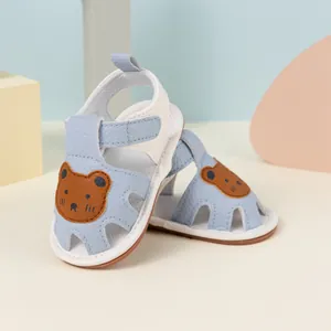 Light blue baby sandals with cute bear patch and breathable cut-outs for summer