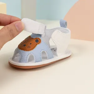 Detail view of the secure hook and loop closure on breathable blue baby bear sandals