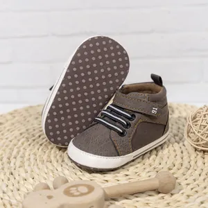 Detailed view of dark brown baby walker shoes with elastic laces and non-slip soft soles