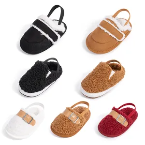 Multiple styles of plush baby slippers with non-slip soles and elastic heel straps