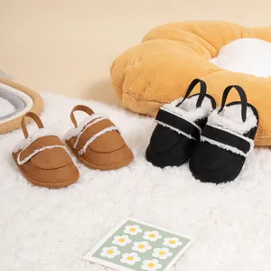 Detail view of warm plush lining and adjustable straps on stylish baby winter slippers