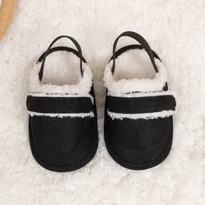 Top view of baby winter slippers with faux shearling lining and elastic heel straps