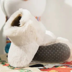 Detail of baby winter boots with thick plush lining and anti-slip silicone dot soles