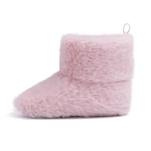 Detail of pink plush baby boots showing high-density fleece and soft heel pull loop
