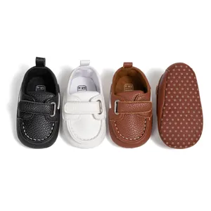 Non-slip PU leather baby walking shoes with Velcro straps in black, white, and brown