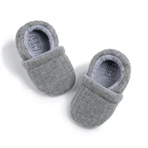 Close-up of grey ribbed baby shoe insole showing age 0-6 months and size EUR 18