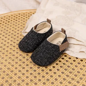 Breathable dark grey tweed baby walking shoes with soft cloth soles and brown pull tabs