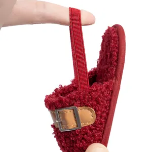 Close-up of the elastic heel strap on plush baby shoes showing stretchability