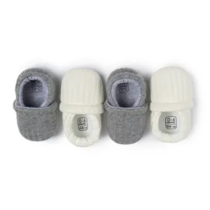 Knitted infant walking booties in grey and beige for 0-6 months, soft ribbed sole
