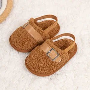 Detail showing plush caramel brown baby walker shoes with fleece texture and elastic heel strap