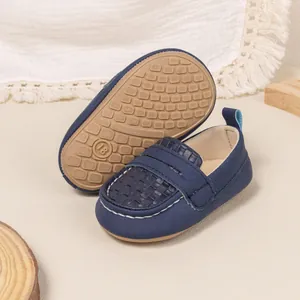 Detail of dark blue baby loafers with textured fabric and anti-slip rubber sole size 18