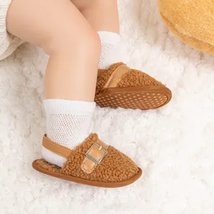 Detail of warm lamb wool baby slippers with elastic heel strap and non-slip sole