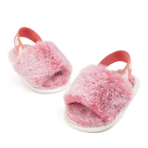 Pink faux fur infant sandals with heart-patterned elastic heel strap and non-slip sole