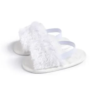 White fuzzy baby slippers with glitter sparkles and elastic back strap for toddlers