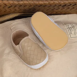 Close-up of baby pre-walker shoe with woven leather texture and non-slip soft sole