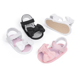 Infant bow sandals with non-slip soles and velcro straps in white, black and pink colors