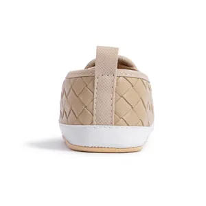 Rear view detail of khaki woven baby slip-on shoes with soft soles and heel pull tabs