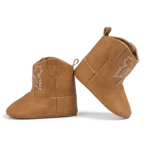 Broderie détaillée et texture cuir sur bottes de cowboy marron pour bébé avec zip