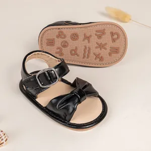 Detail of baby walking sandals with non-slip zodiac rubber sole and cute bow design