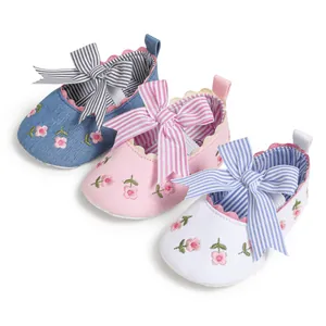 Soft-sole baby shoes with stripe bow and flower embroidery in blue, pink, and white